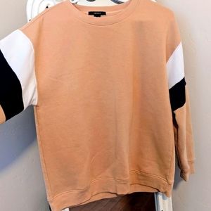 Tan sweater with white/navy blue striped sleeves